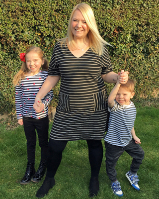 Emma Conway smiling with her two children
