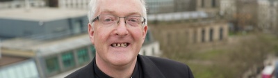 The Reverend Canon Dr Mark Pryce in black shirt